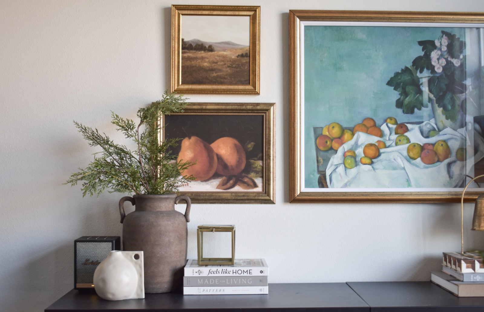 Gallery wall with brass lamp